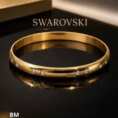 SWAROVSKI ロゴ刻印 ゴールドバングル 上品