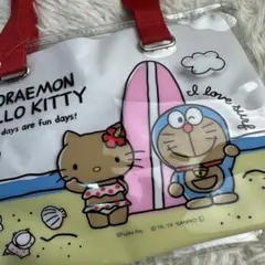 新品 ドラえもん ハローキティ クリアトートバッグ　　日焼けキティ