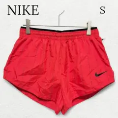 984【ナイキ】ランニングショートパンツ 総柄 ロゴ オレンジ スポーツ 運動