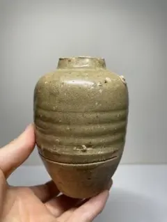 Antique ceramic vase, ash glaze, crouching figure, tea ceremony utensil, Tang Dynasty, tea caddy, antique art piece.
