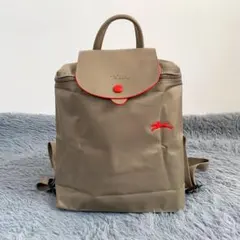 Longchamp 折り畳みミニリュック ブラウン 濃い赤ロゴ - メルカリ