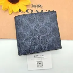 未使用級✨COACH A BATHING APE 二つ折り財布 シグネチャー 紺 - メルカリ