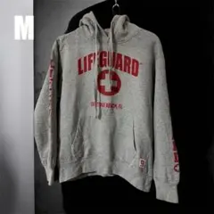 LIFEGUARD DAYTONA BEACH ロゴプリント フードパーカー M