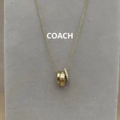 COACHゴールド 3連リング シグネチャーネックレス