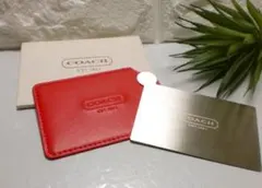 新品未使用・COACH・コーチカバー付きミラーレザー製のスリムカードケース