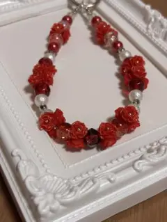 ハンドメイド 赤い花の携帯ストラップ 柔らかいバラ ソフトバラ