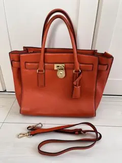 マイケルコース　オレンジ レザー ハンドバッグ　ショルダー紐付き