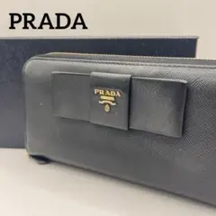 100【極美品】PRADA 二つ折り財布 長財布 リボン付き - メルカリ