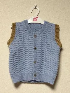 水色と茶色の編み込みベスト 約90～100cm