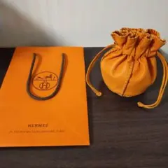 HERMES オレンジ レザー 巾着ポーチ