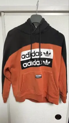 adidas パーカー オレンジ ブラック