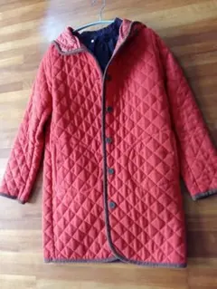 オレンジ キルティングジャケット フード付き