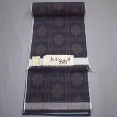 M25-14 新品保管品 正絹 十日町 紬 着尺反物 黒紺 華文