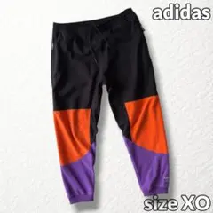 【アディダス】トラックパンツ 裏起毛 異素材切替 カラーブロック 黒紫橙系 XO