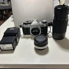 動作確認済】 Canon AE-1 F2-7-7v - メルカリ
