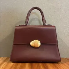 anuans モチーフ付きミニハンドルバッグ ボルドー - メルカリ