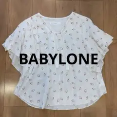 BABYLONE 半袖ブラウス ホワイト 総柄 タッセル付きのサムネイル