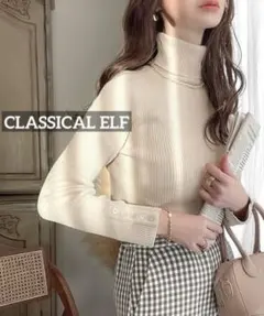 k115 CLASSICAL ELF 袖シェルボタン付きタートルネックリブニット