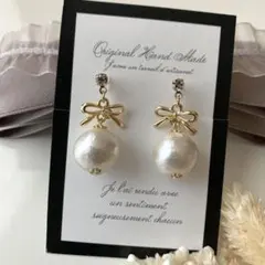 リボンとコットンパール の樹脂イヤリング(ピアス変更可能)