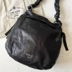 【希少】プラダ 三角ロゴ 編み込み ワンショルダーバッグ 巾着 レザー 黒
