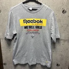 Reebok WE SELL GOLD Tシャツ グレー
