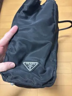 PRADA プラダ バニティバッグ 巾着ポーチ ナイロン 三角ロゴ 黒 - メルカリ