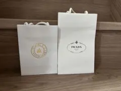 PRADAとGUERLAINのショップ袋のサムネイル