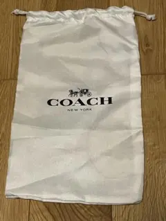 COACH ロゴ入りホワイト収納袋