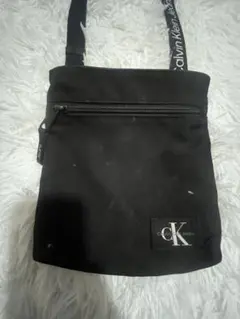 カルバンクライン ck ショルダーバッグ キャンバス レザー 総柄 黒 茶 