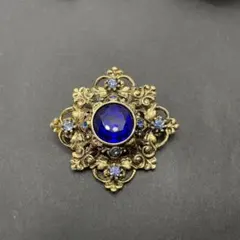青いストーンの花模様ブローチ 金属