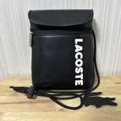 LACOSTE ブラック ブランドネームロゴスマホポーチ
