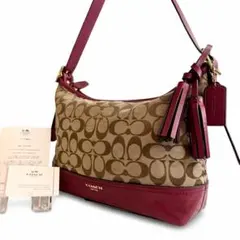 COACH シグネチャー キャンバス レザー ショルダーバッグ タッセル ピンクのサムネイル