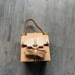 極美品✨ niels peeraer リュック シルバー ターンロック - メルカリ