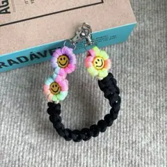 パラコード　ハンドスマホストラップ　☺︎ニコちゃん☺︎ お花　ハンドメイド