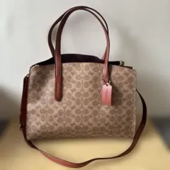 COACH（コーチ）のシグネチャー チャーリー キャリーオール