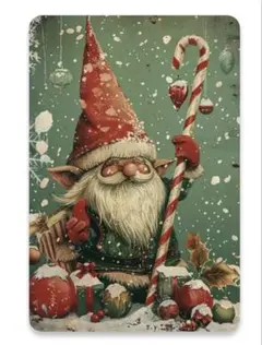 雪の中でキャンディケインを持つノーム ブリキ看板