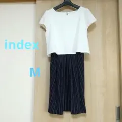 ホワイトメッシュトップスとストライプスカート