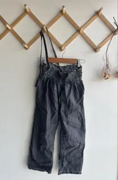 himher×YANUKワンストラップパンツ〔ブラックデニム】M