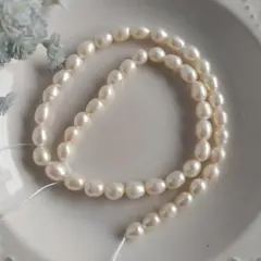 P565-14ミルキーホワイト淡水パールビーズ オーバル/ドロップ型約6-7mm