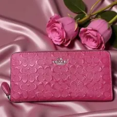 COACH ピンク エンボス加工 長財布