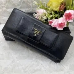 PRADA 長財布 サフィアーノ フィオッコ リボン 黒 - メルカリ