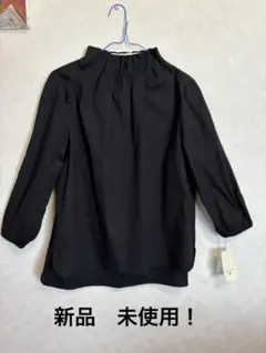ジャンルネ　黒い長袖ブラウス Mサイズ ストレッチ 新品　未使用(タグ付き)
