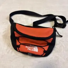 THE NORTH FACE ボディバッグ オレンジ/ブラック日用品ファッション