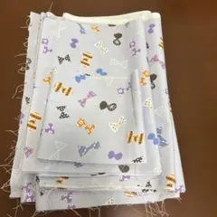 パープルリボン柄オックス生地 はぎれ