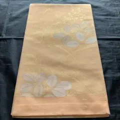 夏帯　薄いオレンジ色の葉模様 袋帯　西陣まいずるのサムネイル