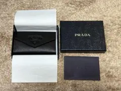 PRADA サフィアーノレザー 長財布 モチーフ付き バッヂ - メルカリ