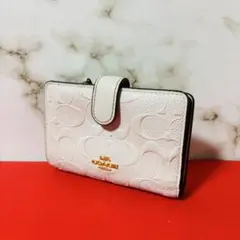 0060 COACH シグネチャー 金ロゴ ホワイト レディース 折り財布