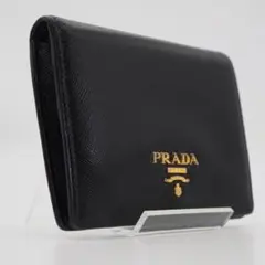 【極美品】PRADA 折り財布 サフィアーノ レザー 三角ロゴ ブラック 極美品】PRADA 二つ折り財布 レザー サフィアーノ 三角ロゴ ブラック