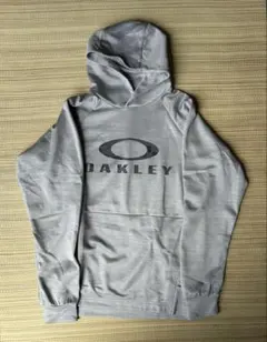 OAKLEY オークリー パーカー グレー　光沢　Ｌのサムネイル