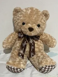 ベージュのクマのぬいぐるみ